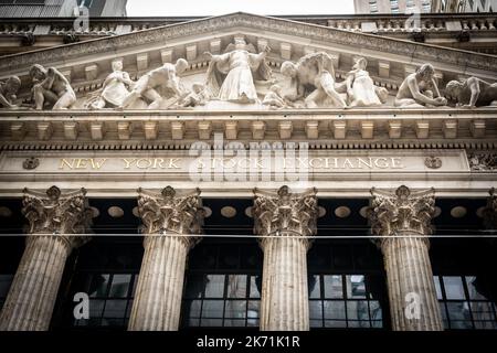 New York, USA - September 19, 2022: Bas-relief and inscription on the facade of the New York Stock Exchange on Wall Street Stock Photo
