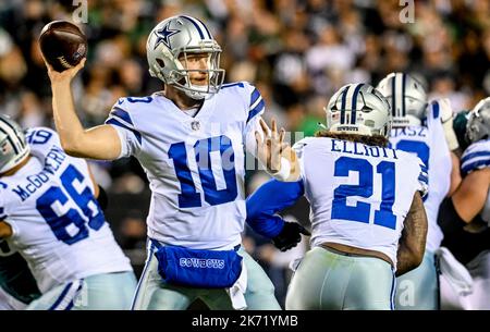 PHILADELPHIA, PA - OCTOBER 16: Dallas Cowboys Quarterback Cooper Rush (10)  hands off the ball to Dallas Cowboys Running Back Ezekiel Elliott (21)  during the second half of the National Football League