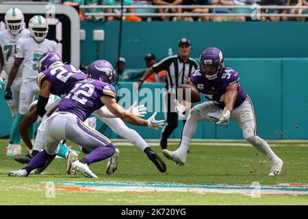 Sunday, October 16, 2022; Miami Gardens, FL USA;  Miami Dolphins safety Elijah Campbell (22) and Minnesota Vikings linebacker Eric Kendricks (54) figh Stock Photo