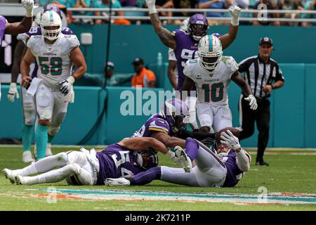 Sunday, October 16, 2022; Miami Gardens, FL USA;  Miami Dolphins safety Elijah Campbell (22) and Minnesota Vikings linebacker Eric Kendricks (54) figh Stock Photo