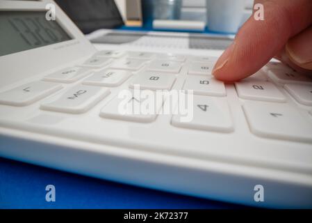 Close-up view of using calculator, shot with macro probe lens Stock Photo