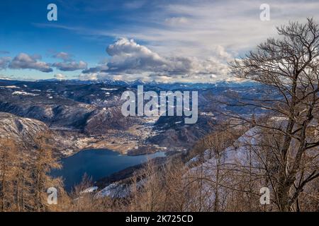 Bohinj, Slovenia - Panoramic view of Lake Bohinj (Bohinjsko Jezero) on a sunny winter day from top of the Vogel mountain located within the Bohinj Val Stock Photo