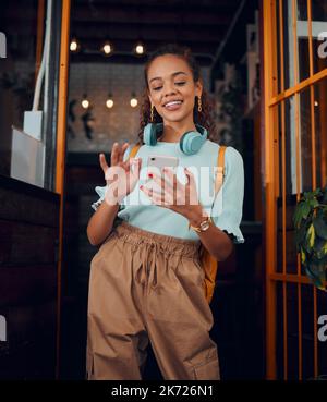 Happy gen z young woman with smartphone, social media fashion influencer in trendy cafe and youth culture in Miami. .Trendy student communication Stock Photo