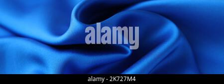 Blue satin fabric closeup. Natural fabric or polyester satin concept Stock Photo