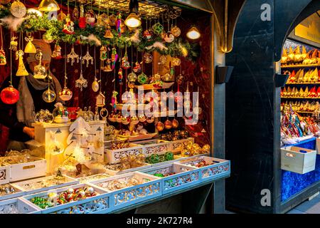 Handmade glass Christmas decorations on sale at street kiosk during famous traditional Christmas market in Vienna, Austria. Stock Photo