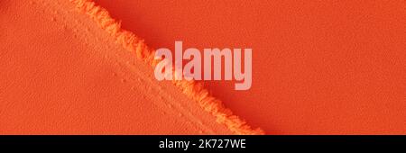 Orange fabric and texture of threads of bright orange fabric with folds Stock Photo