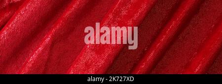 Velor fabric in red waves. Gorgeous elastic velvet fabric has velvety pile Stock Photo