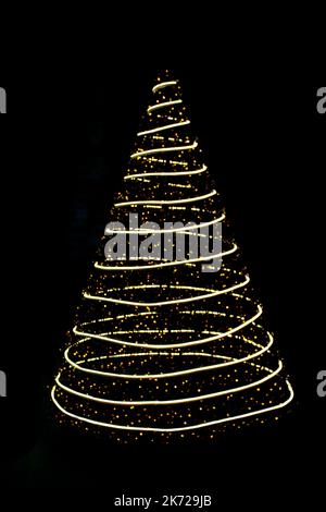 Defocused lights Christmas tree on black isolated background. Design element. New Year. Copy space Stock Photo