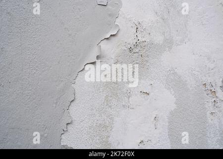 White wall with peeling paint Stock Photo