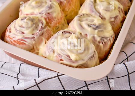 Homemade Pumpkin cinnamon rolls with cream cheese Stock Photo