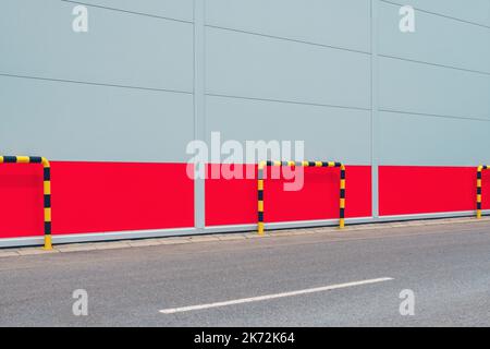 Impact protection guarding rail, yellow and black stripped bollard as
