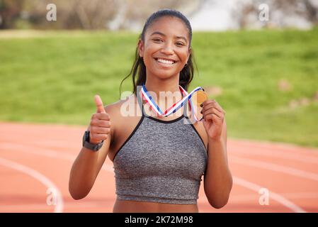 The goal is to win. Cropped portrait of an attractive young female athlete celebrating her victory. Stock Photo