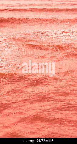 Real photo sea water waves, abstract background, nature power, bright orange red more tone in stock Stock Photo