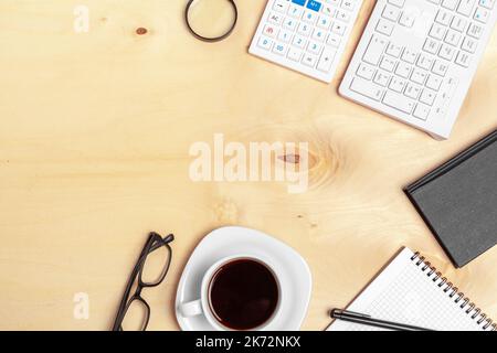 Office table with note paper, computer keyboard and supplies close up Stock Photo