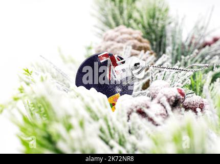 New Year's colorful background with a ball on which the flag of Turks and Caicos Islands is depicted. The concept of the New Year holiday and Stock Photo