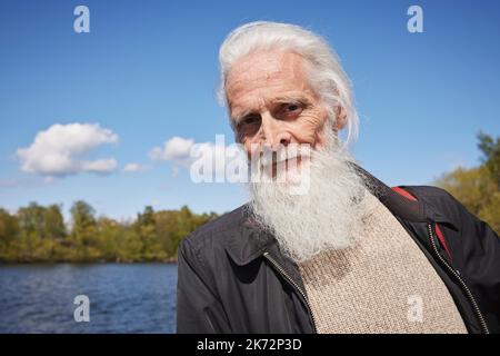 Senior man looking at camera Stock Photo