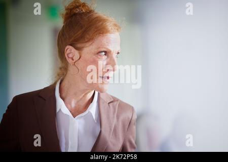 Mature businesswoman looking away Stock Photo