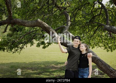 Brother and sister having selfie Stock Photo
