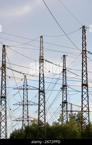 Low angle view of electricity pylons Stock Photo