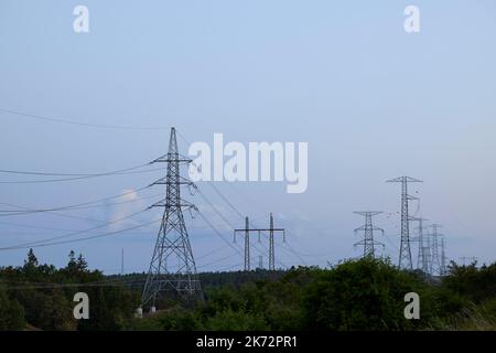 Low angle view of electricity pylons Stock Photo