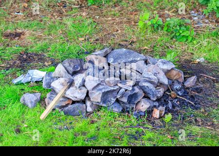Remains of an old camp fire in a stone circle Stock Photo