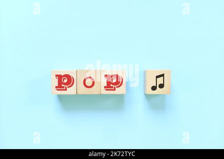 Pop music genre or style concept. Creative flat lay typography composition in blue background. Stock Photo