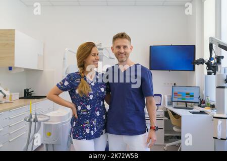 Portrait of dentist posing with nurse in dentists ambulance. Stock Photo