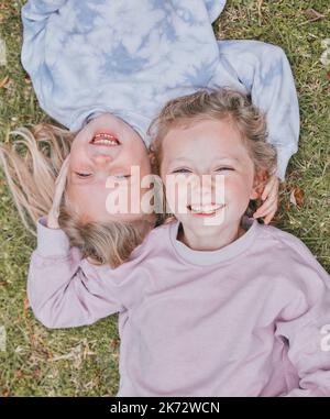Enjoy the little moments, they mean a lot. two adorable little girls having fun in a garden. Stock Photo
