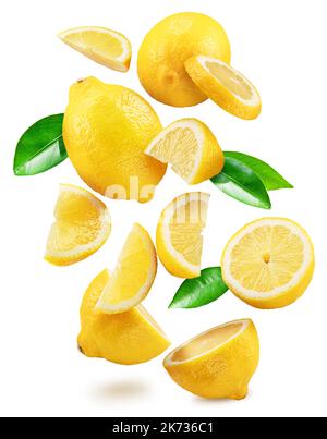 Ripe lemon fruits, slices and leaves flying in air white background. File contains clipping paths. Stock Photo