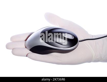 Computer mouse in gloved hand isolated on white Stock Photo