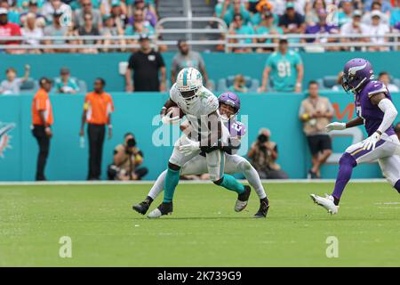 Minnesota Vikings safety Camryn Bynum (24) defends Miami Dolphins wide  receiver Tyreek Hill (10) during the