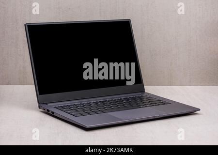 black mock up on a laptop screen on a gray background close up with clipping path Stock Photo