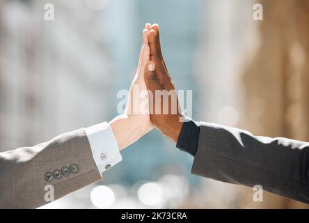 Were can only progress from here. two business people giving each other a high five. Stock Photo