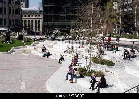 Wide view across square with city in background. Exchange Square, London, United Kingdom. Architect: DSDHA, 2022. Stock Photo