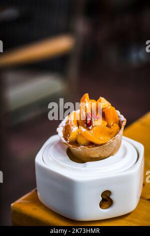 Apple Tartin dessert of Roast apple, cinnamon tartlet and  vanilla gelato Stock Photo