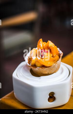 Apple Tartin dessert of Roast apple, cinnamon tartlet and  vanilla gelato Stock Photo