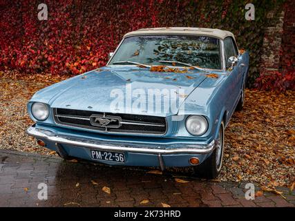 Brummen, Province Gelderland, The Netherlands, 15.10.2022, Old timer Ford Mustang convertible from 1965 in blue color, first generation Stock Photo