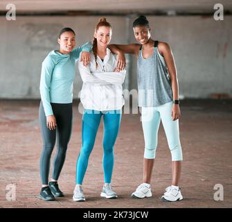 Sisters doing it for themselves. a group of friends hanging out before working out together. Stock Photo