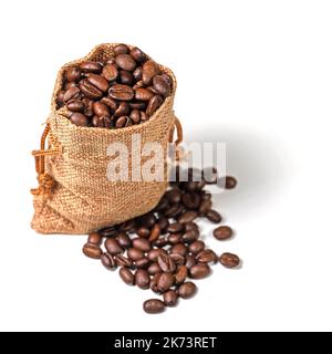 Roasted coffee beans in a jute sack Stock Photo