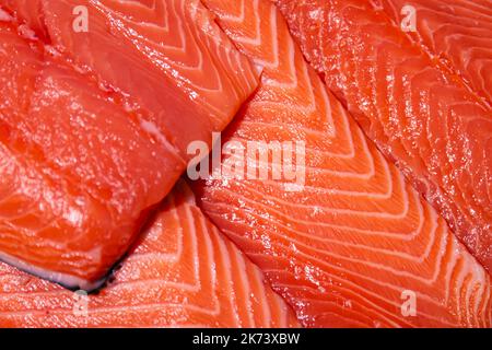 Raw salmon, trout close-up on the showcase of a seafood store. Stock Photo