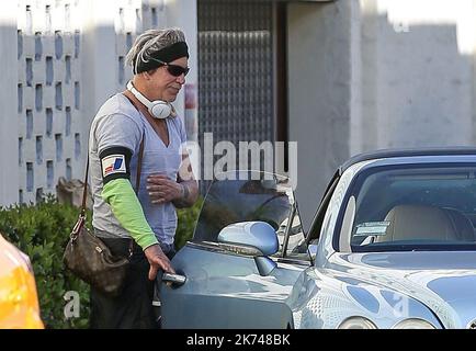 Micky Rourke Car Mickey Rourke is seen entering a blue Bentley in Beverly Hills, USA ...