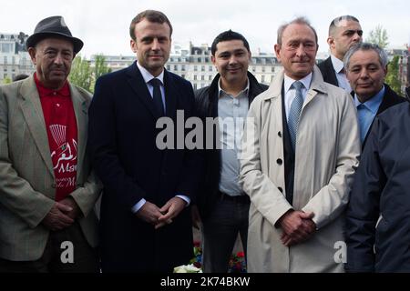 Emmanuel Macron , former mayor of Paris Bertrand Delanoe and Said Bouarram son of Brahim Bouarram. French presidential election candidate for the En Marche movement Emmanuel Macron takes part in a tribute ceremony to Brahim Bouarram, a Moroccan who drowned in 1995 when right-wing extremists threw him from a bridge after a National Front rally, Paris, FRANCE - 1/05/2017 Stock Photo