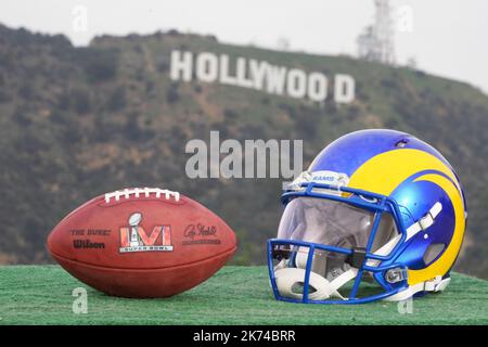 symbolic picture for Super Bowl LVI, Rams helmet and ball in front of Hollywood sign, Los Angeles, California, USA Stock Photo