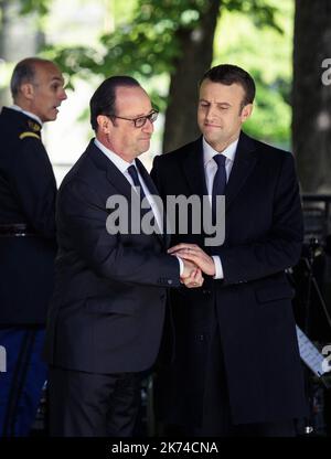 Outgoing President Francois Hollande and elected President Emmanuel Macron jointly commemorate the 12th national day of the Memoirs of the Treaty, Slavery and their Abolition in Paris in the gardens of Luxembourg Stock Photo