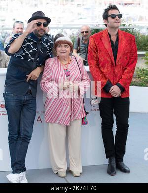 Singer Matthieu Chedid, director Agnes Varda and JR attend the 'Faces, Places (Visages, Villages)' photocall during the 70th annual Cannes Film Festival at Palais des Festivals Stock Photo