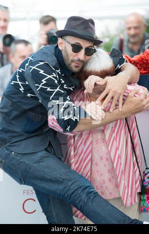 Singer Matthieu Chedid, director Agnes Varda and JR attend the 'Faces, Places (Visages, Villages)' photocall during the 70th annual Cannes Film Festival at Palais des Festivals Stock Photo