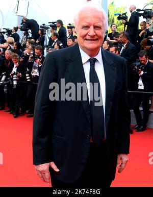 ; French actor Andre Dussollier laughs as he arrives on May 23, 2017 for the '70th Anniversary' ceremony of the Cannes Film Festival in Cannes, southern France.   70th annual Cannes Film Festival in Cannes, France, May 2017. The film festival will run from 17 to 28 May. Stock Photo
