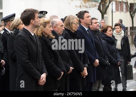 French President Emmanuel Macron and Paris mayor Anne Hidalgo observe a minute of silence outside the satirical newspaper Charlie Hebdo former office, to mark the third anniversary of the attack, in Paris, on January 7, 2018. French President Emmanuel Macron laid a wreath in front of the former offices of satirical magazine Charlie Hebdo to mark three years since the massacre of its staff in an Islamist attack. Two French jihadists who had sworn allegiance to al-Qaeda killed 11 people at Charlie Hebdo's offices in 2015 over the staunchly atheist magazine's satirical coverage of Islam and the p Stock Photo