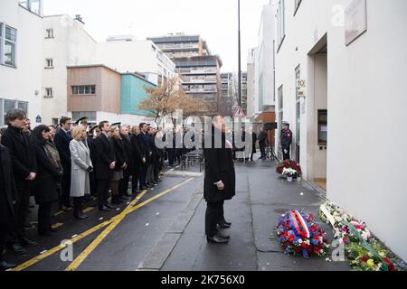 French President Emmanuel Macron and Paris mayor Anne Hidalgo observe a minute of silence outside the satirical newspaper Charlie Hebdo former office, to mark the third anniversary of the attack, in Paris, on January 7, 2018. French President Emmanuel Macron laid a wreath in front of the former offices of satirical magazine Charlie Hebdo to mark three years since the massacre of its staff in an Islamist attack. Two French jihadists who had sworn allegiance to al-Qaeda killed 11 people at Charlie Hebdo's offices in 2015 over the staunchly atheist magazine's satirical coverage of Islam and the p Stock Photo