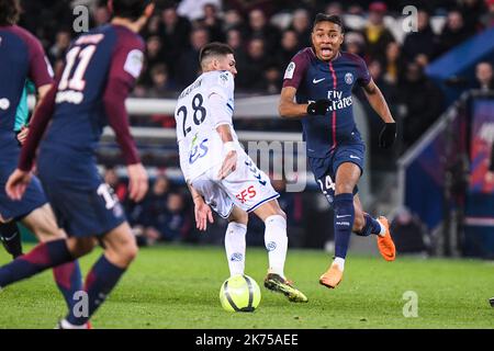 Paris Saint Germain's Christopher Nkunku (R) in action against Jonas Martin of Strasbourg (C) during the French Ligue 1 soccer match between Paris Saint Germain (PSG) and Racing Club Strasbourg Alsace at the Parc des Princes stadium in Paris, France, 17 February 2018.  Stock Photo